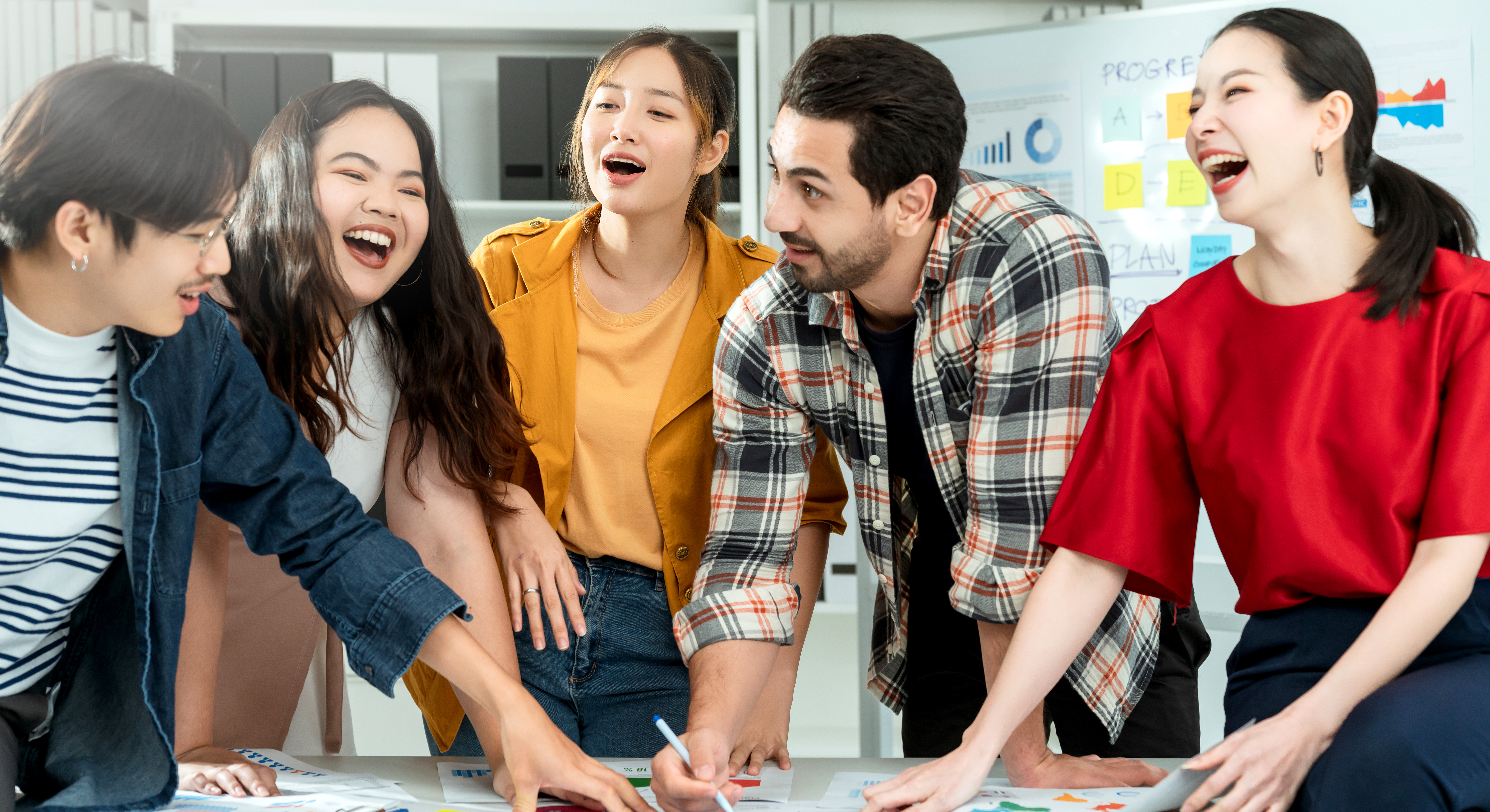 A team of coworkers having a discussion together at a table